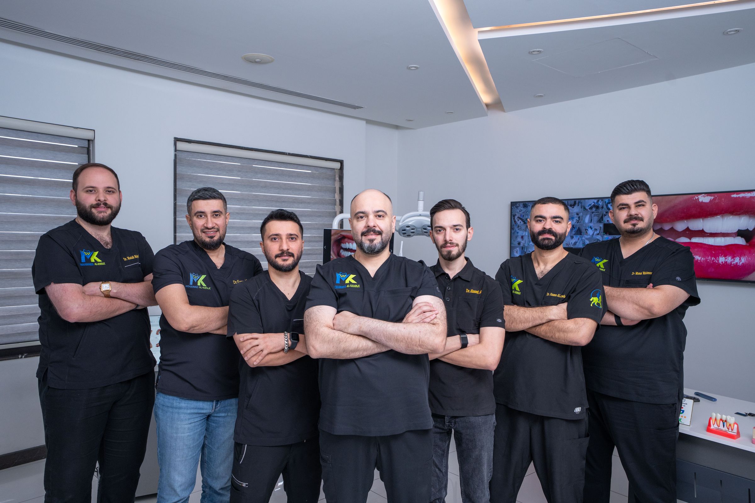 The Mohammed Al-Khfaje Dental Center team in black scrubs