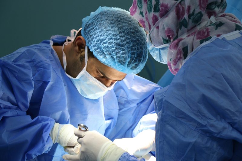 A surgical team during an oral procedure