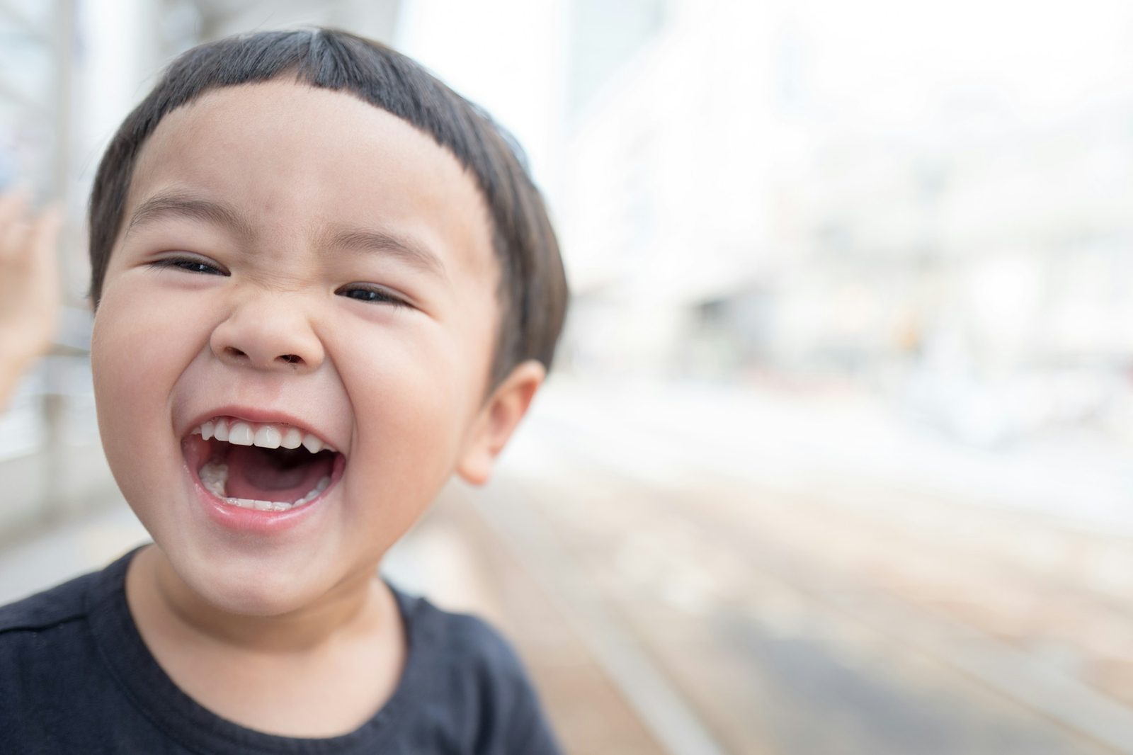A young boy laughing